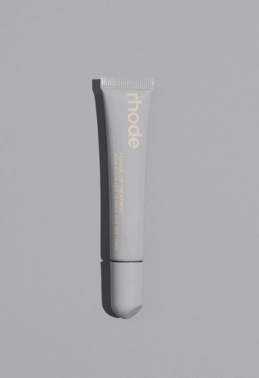 Прозорий тінт для вуст із пептидами з ароматом солоної карамелі RHODE Peptide Lip Treatment The Nourishing Lip Layer Salted Caramel